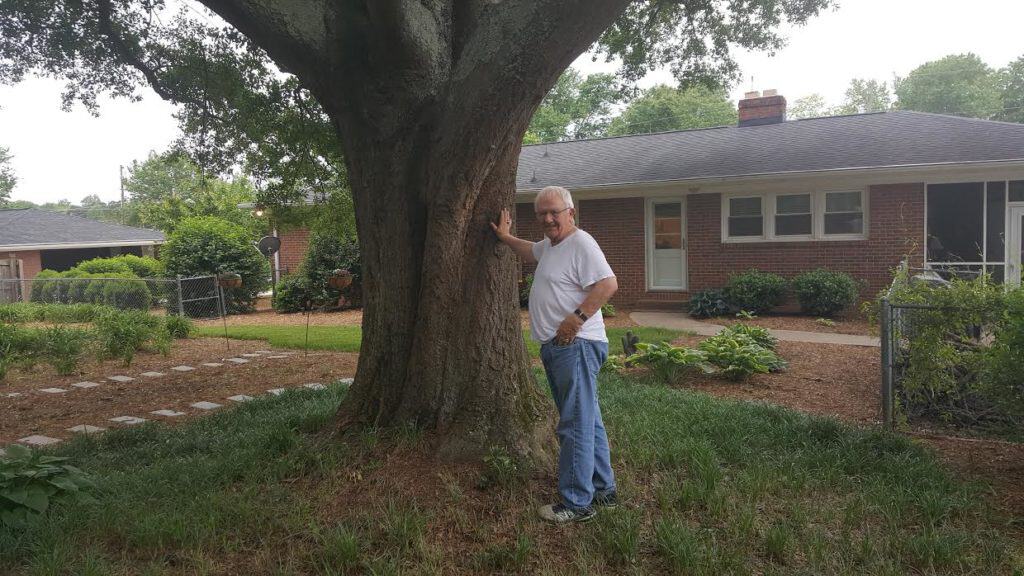 Man Standing in Front of an Oak Tree